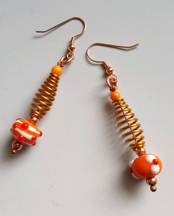 Funky orange glass beads, copper beads, gold aluminum swirls, on copper ear wires