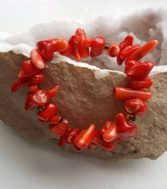 Beautiful red and peach coral irregular shaped beads, green glass beads, all on elastic
