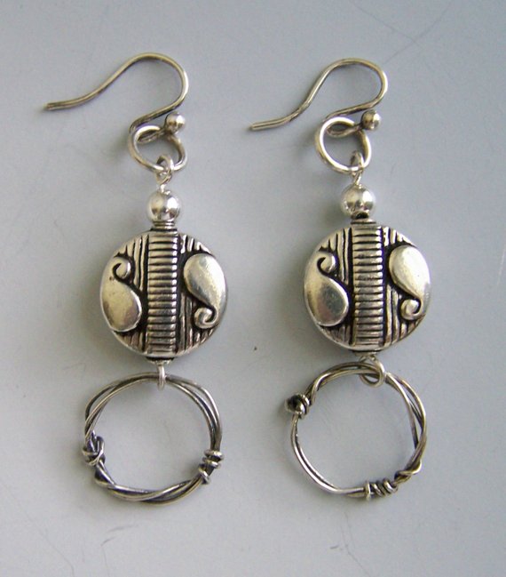 Hollow carved disk sterling beads, hand wrapped oxydized circles, sterling wires