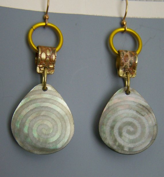 Teardrop shaped shell with swirl design, brass texture findings, aluminum circles, brass ear wires