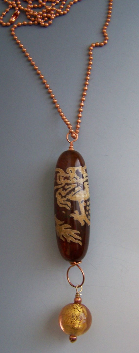Long tubular deep red agate with dragon design, on copper ball chain
