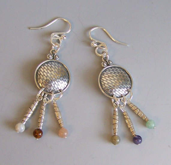 Movement in these earrings. Sterling textured disk, semi-precious stones dangle from tubular silver beads, sterling French ear wires