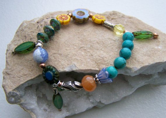 Spring is Here! These beautiful colors with turquoise beads, vintage glass flower beads, glass leaf dangles on elastic