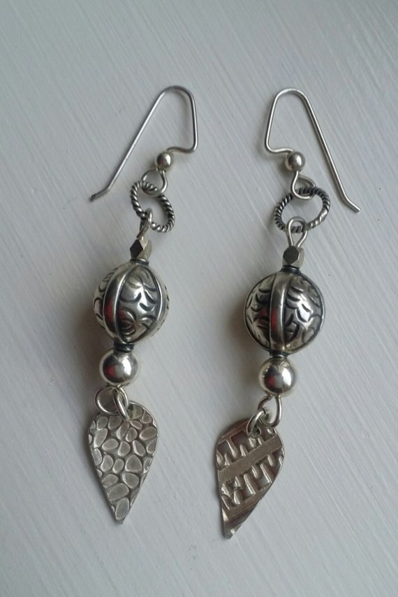 Add to Favorites image 0  Request a custom order and have something made just for you. This seller usually responds within 24 hours. Sterling textured teads and pure silver drop