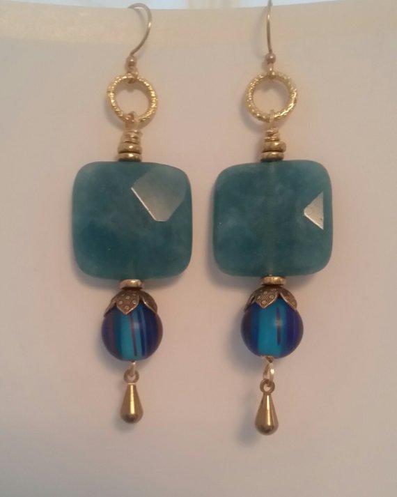 Dyed aquamarine faceted square bead, vintage brass bead caps, blue striped glass drop, and brass dangle